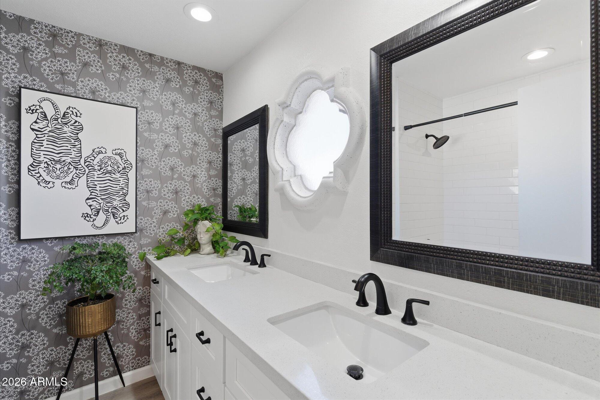4019 East Charter Oak Road Phoenix, AZ 85032 - Photo 13 of 23 a bathroom with a sink and a mirror