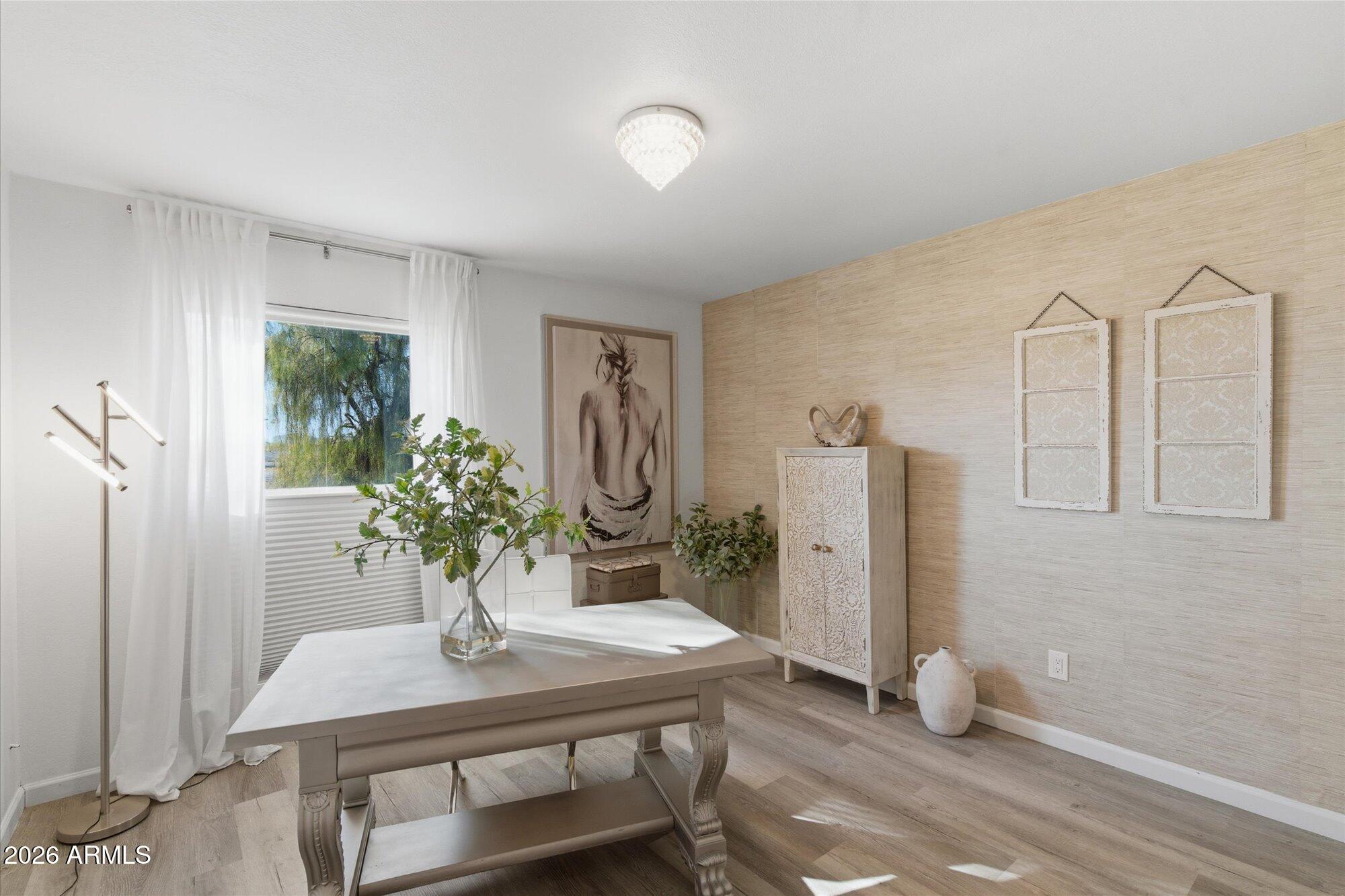 4019 East Charter Oak Road Phoenix, AZ 85032 - Photo 14 of 23 a view of a room with a table and chairs