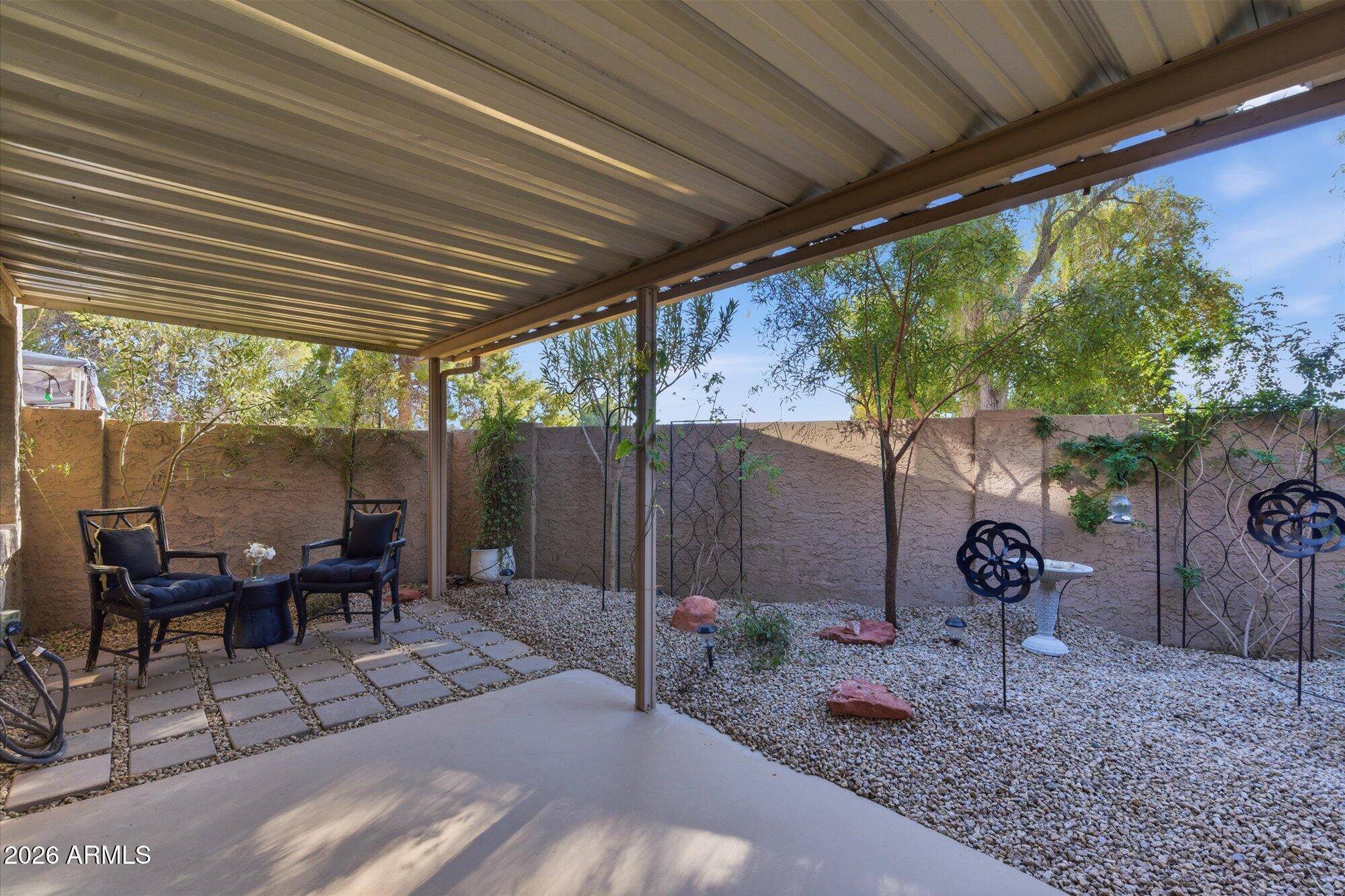 4019 East Charter Oak Road Phoenix, AZ 85032 - Photo 18 of 23 a backyard of a house with garden