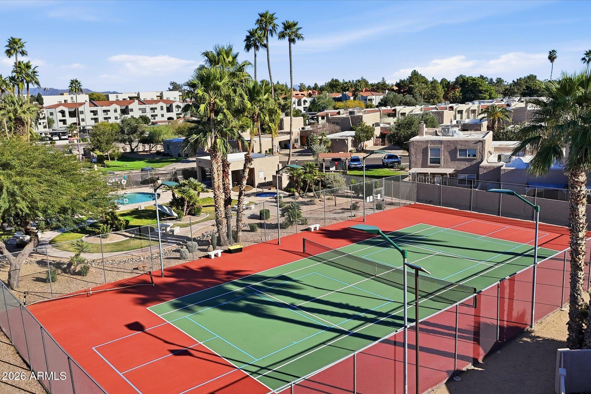4019 East Charter Oak Road Phoenix, AZ 85032 - Photo 22 of 23 a view of a tennis ground with an ocean view