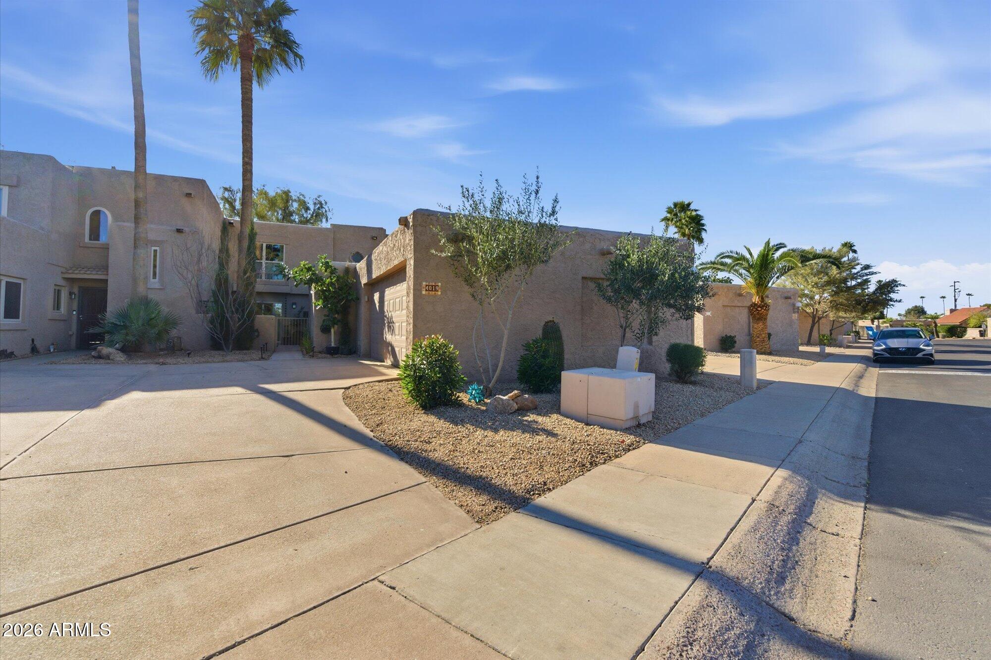 4019 East Charter Oak Road Phoenix, AZ 85032 - Photo 23 of 23 a view of a street with potted plants
