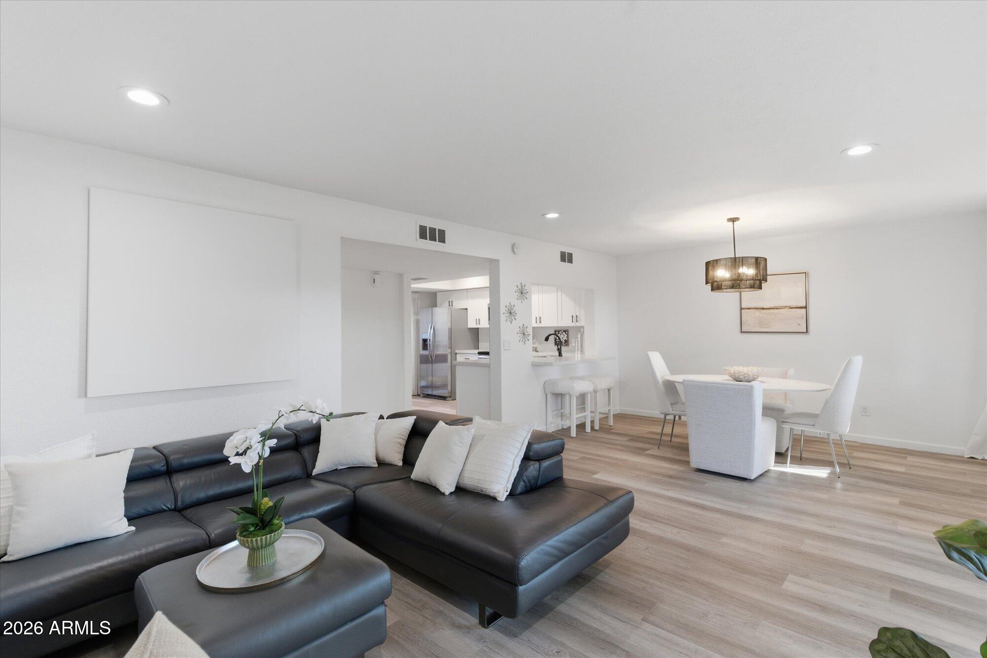 4019 East Charter Oak Road Phoenix, AZ 85032 - Photo 4 of 23 a living room with furniture and a wooden floor