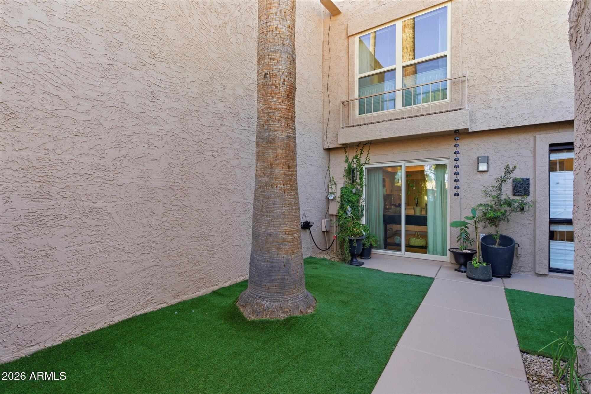 4019 East Charter Oak Road Phoenix, AZ 85032 - Photo 8 of 23 a view of a house with a yard and plants