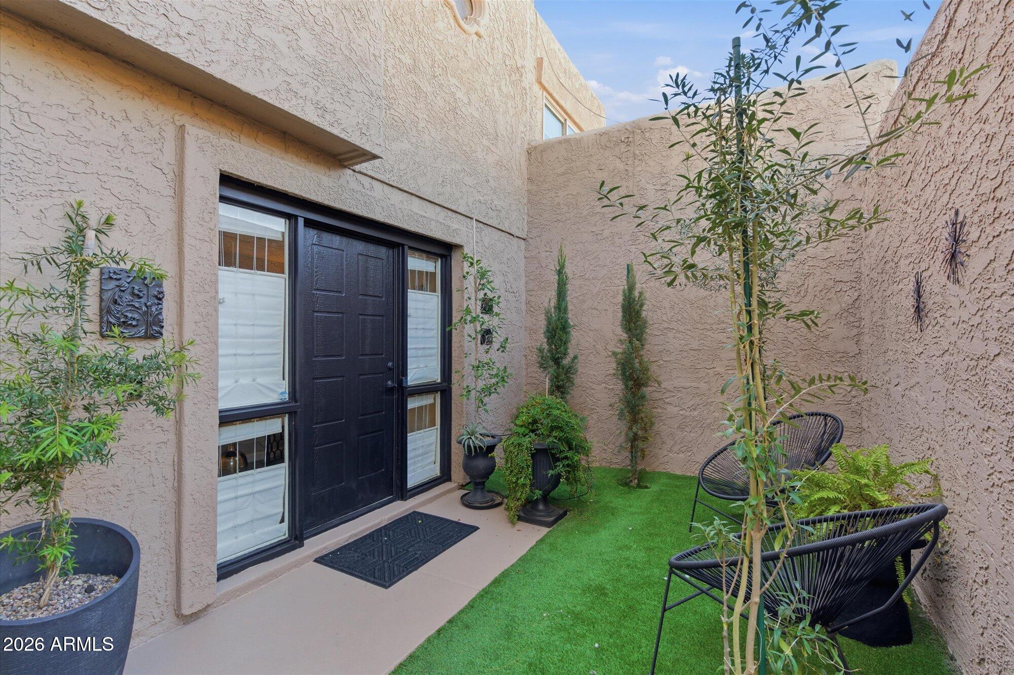 4019 East Charter Oak Road Phoenix, AZ 85032 - Photo 9 of 23 a backyard of a house with lots of green space