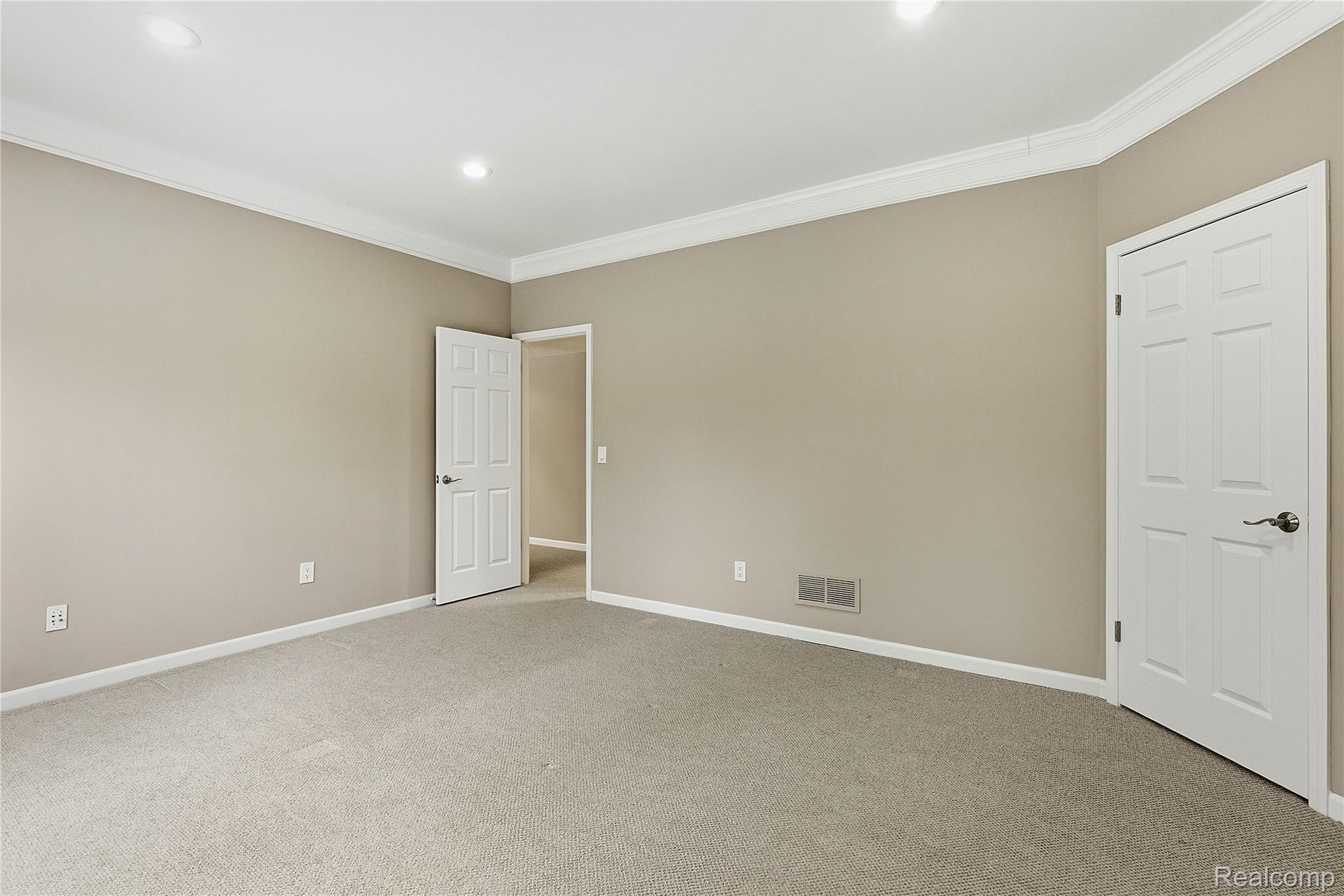 7154 Westchester Road West Bloomfield, MI 48322 - Photo 16 of 38 Unfurnished bedroom with crown molding, light carpet, and recessed lighting