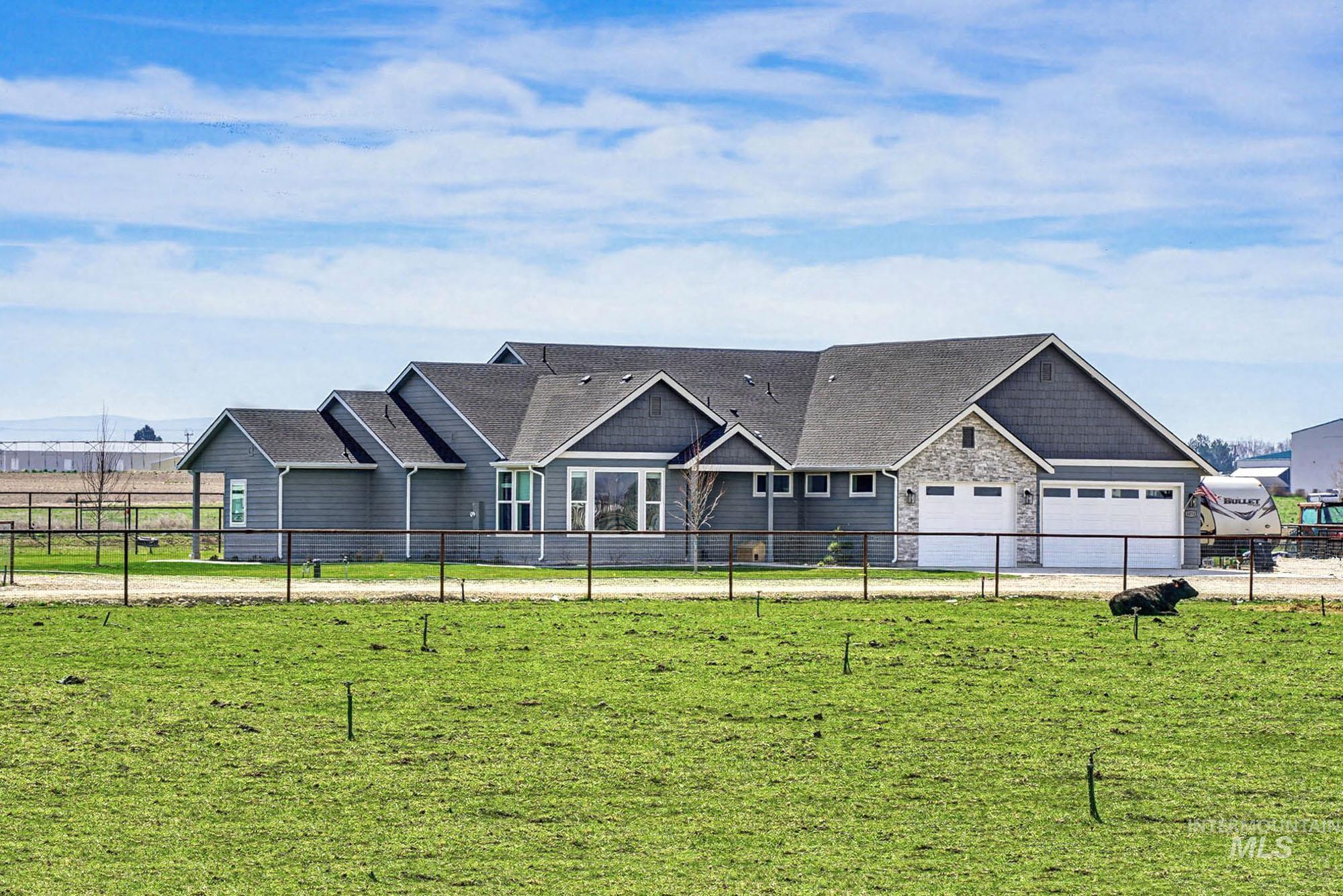 24753 Simplot Boulevard Wilder, ID 83676 - Photo 1 of 47 Craftsman-style house with roof with shingles and stone siding