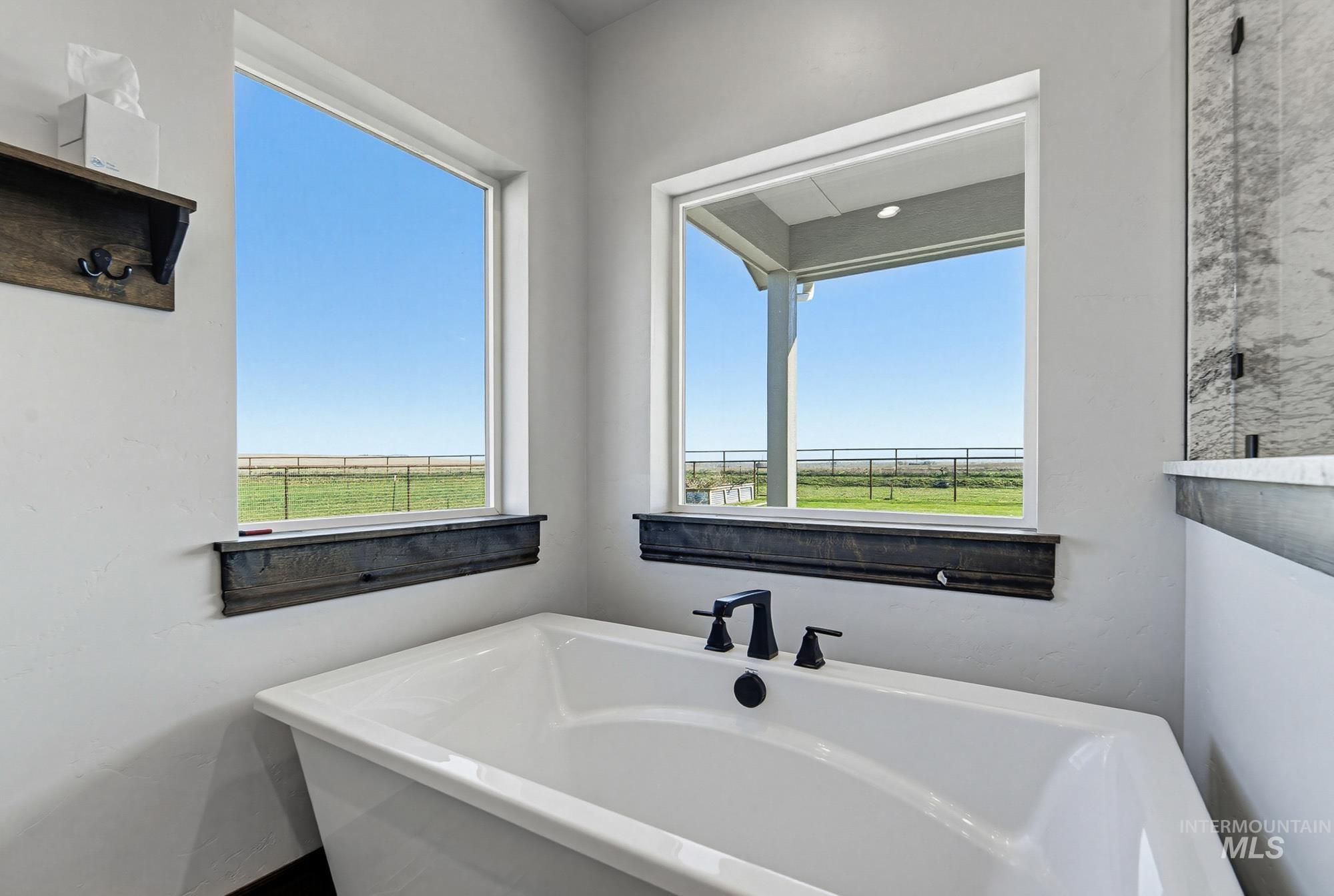 24753 Simplot Boulevard Wilder, ID 83676 - Photo 25 of 47 Bathroom with a freestanding bath