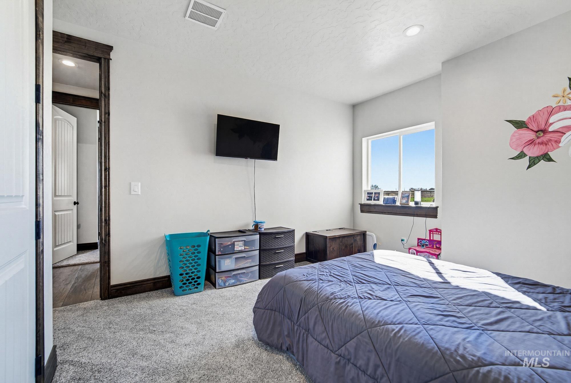 24753 Simplot Boulevard Wilder, ID 83676 - Photo 29 of 47 Bedroom featuring carpet flooring and recessed lighting