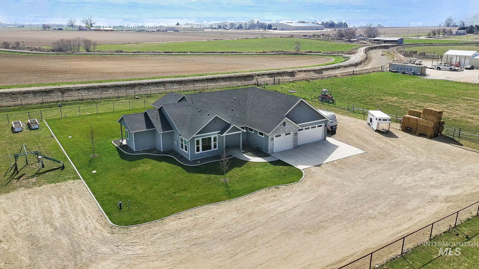 24753 Simplot Boulevard Wilder, ID 83676 - Photo 3 of 47 Aerial view of sparsely populated area with abundant farmland