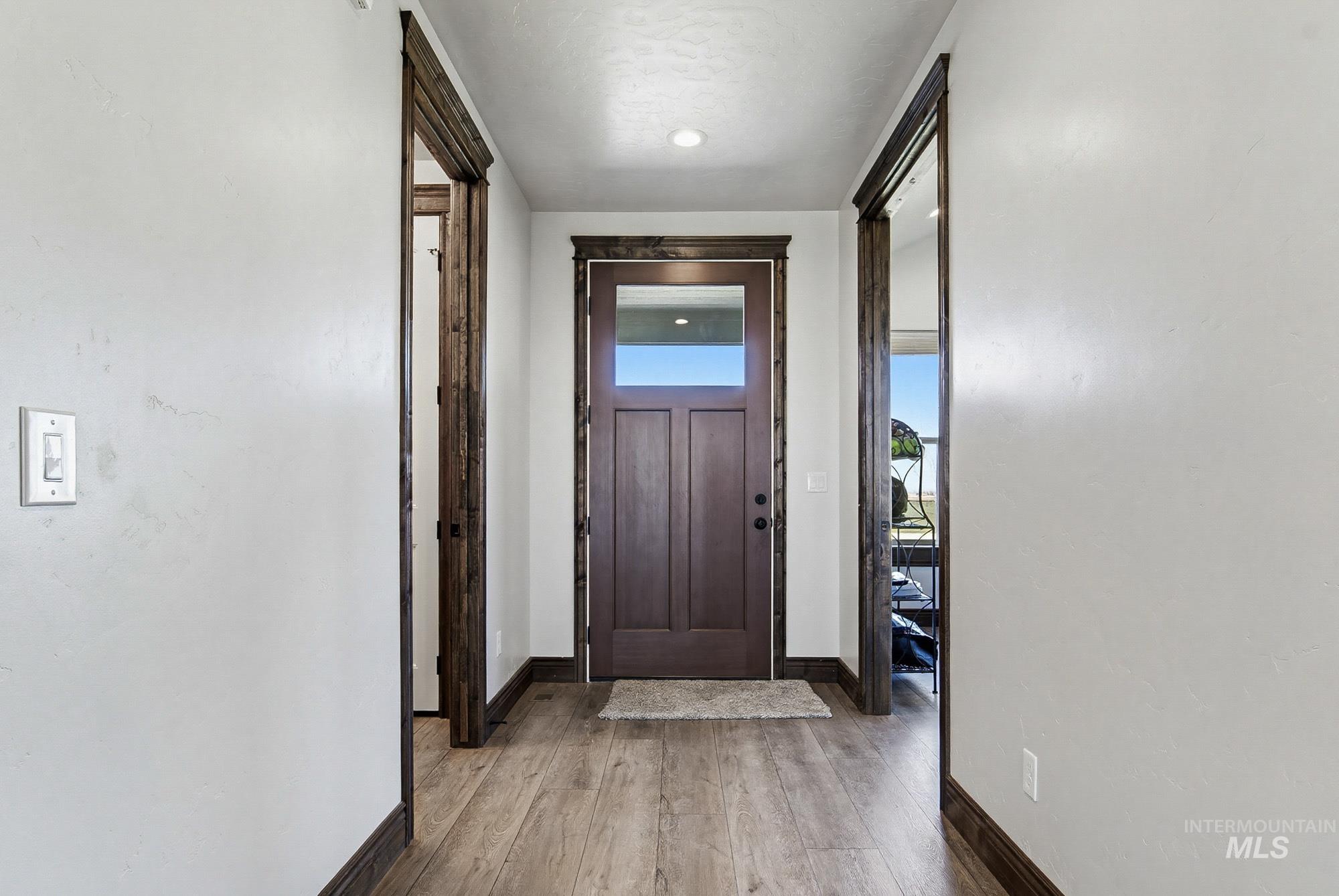 24753 Simplot Boulevard Wilder, ID 83676 - Photo 5 of 47 Entryway with light wood-style floors and baseboards