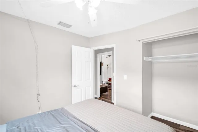 a view of a livingroom with wooden floor and closet