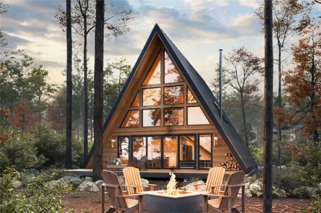 a backyard of a house with table and chairs