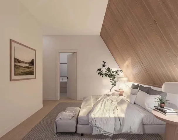 a bedroom with bed and a couch