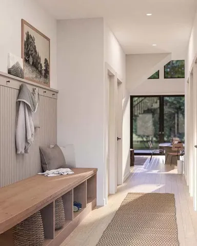 a room with a bed and glass door