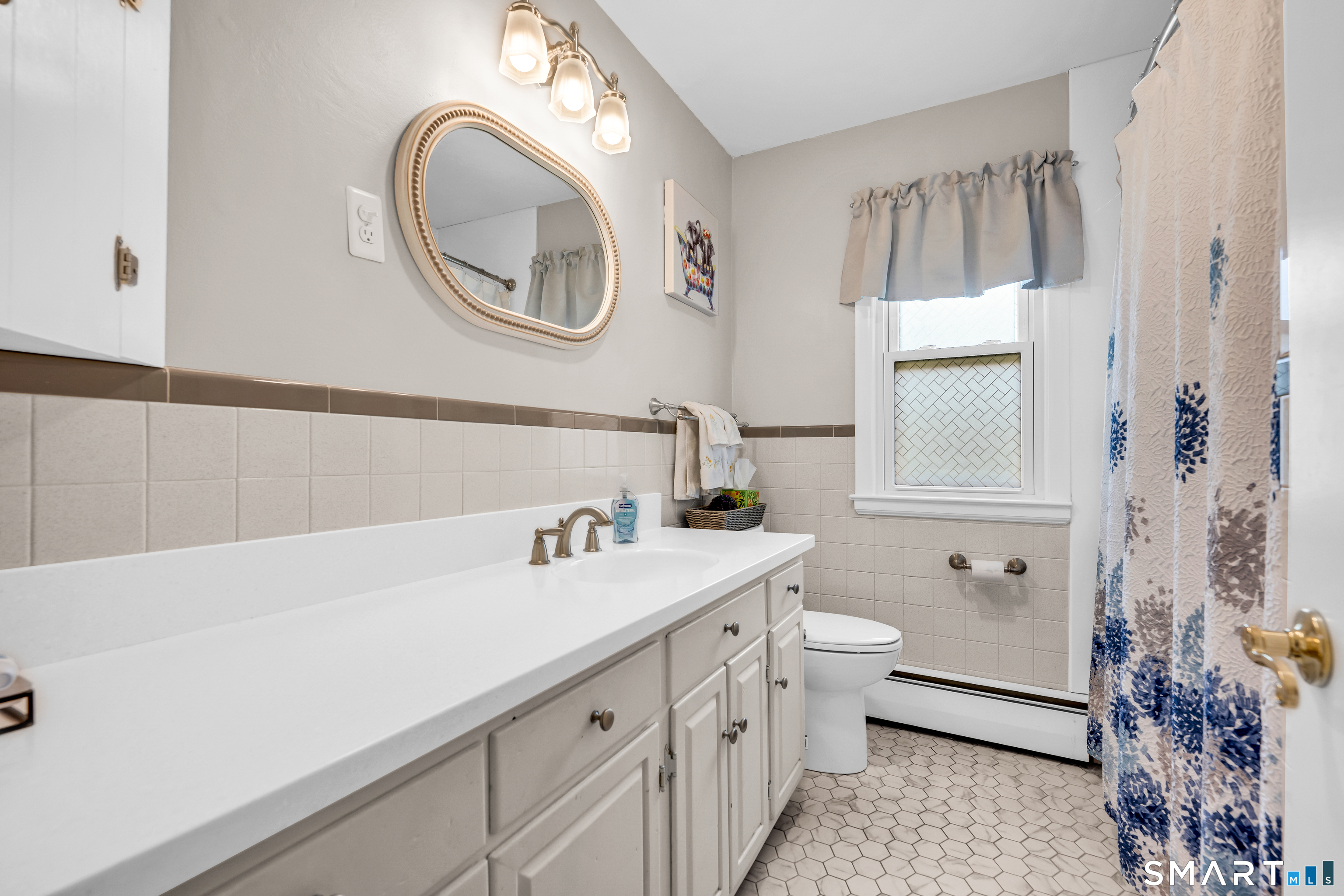 2 Hemlock Road Prospect, CT 06712 - Photo 12 of 27 a bathroom with a sink a toilet and a mirror