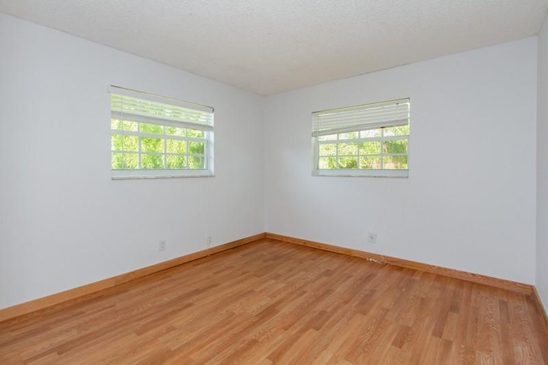 1700 Southwest 13th Place Boca Raton, FL 33486 - Photo 11 of 16 10_1700SW13thPlace_154_3rdBedroom_FlexML