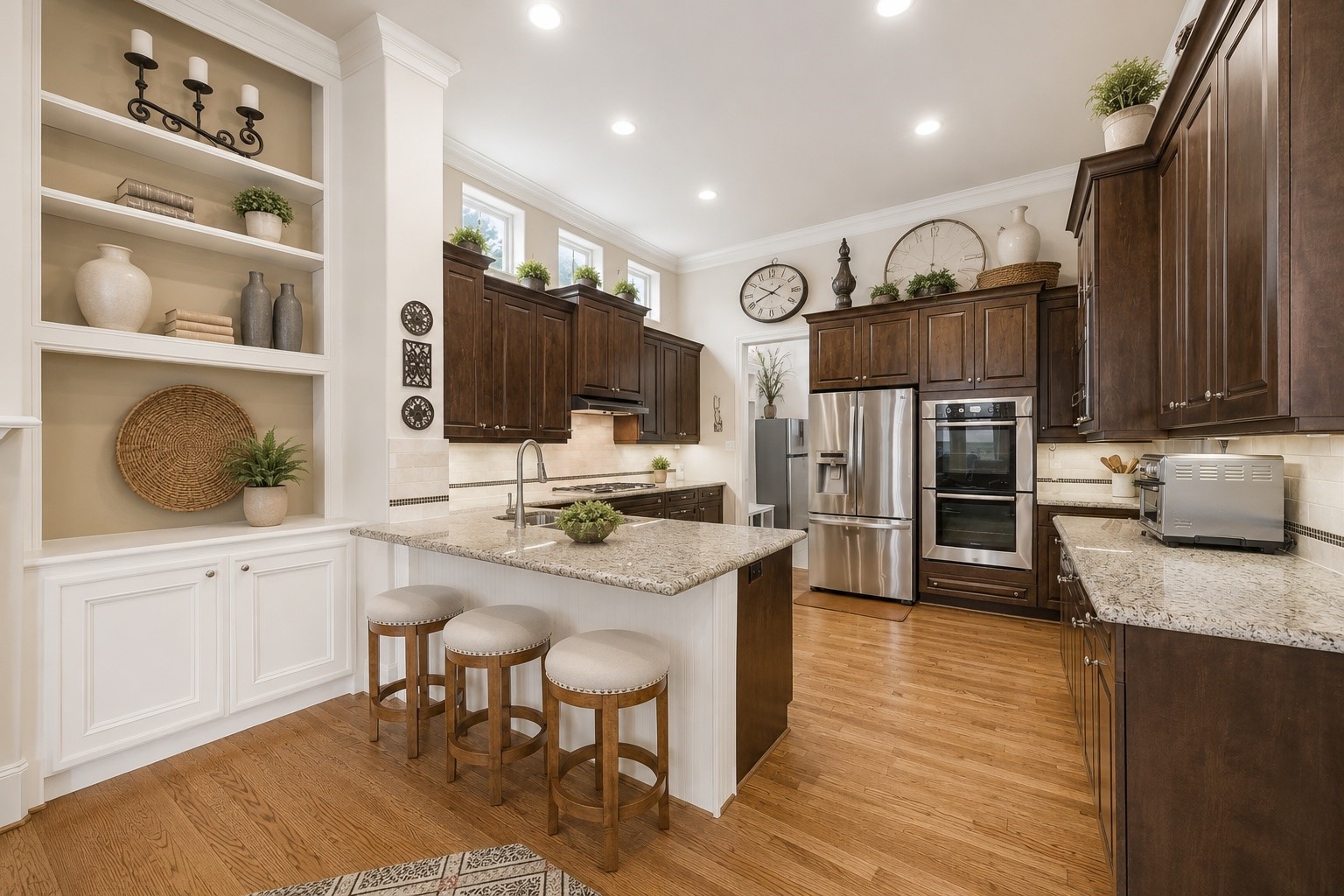 907 Queen Annes Road Houston, TX 77024 - Photo 27 of 31 Thoughtfully designed floor plan with convenient flow from the attached garage to the mudroom and into the kitchen. Features include a walk-in pantry, double ovens, oversized island seating, and abundant cabinetry. This image has been virtually staged for illustrative purposes.