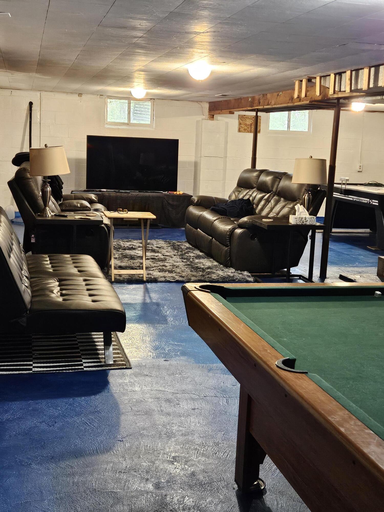 16335 County Line Road Hebron, IN 46341 - Photo 25 of 29 a living room with furniture and a flat screen tv