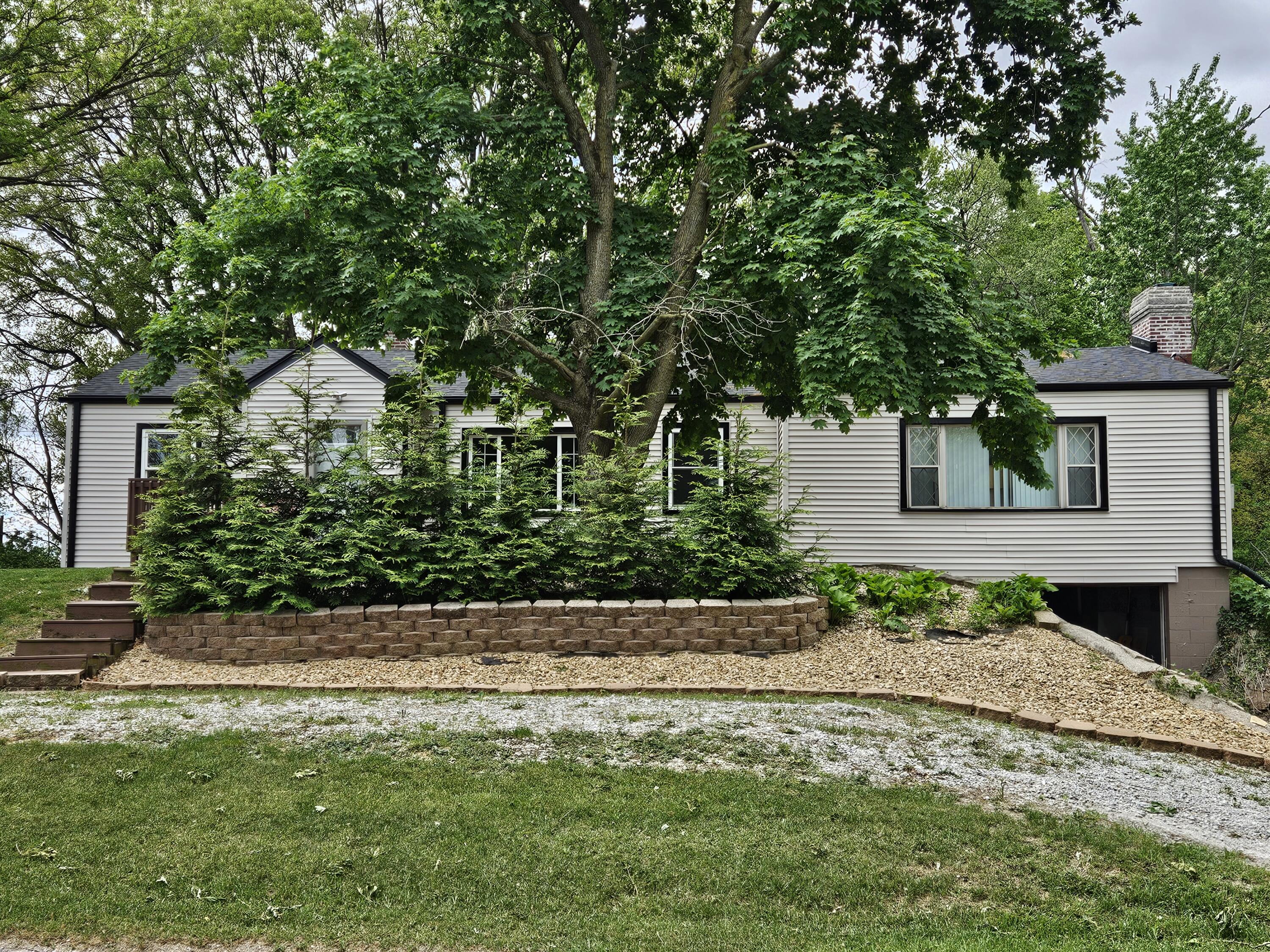 16335 County Line Road Hebron, IN 46341 - Photo 3 of 29 a front view of a house with a yard