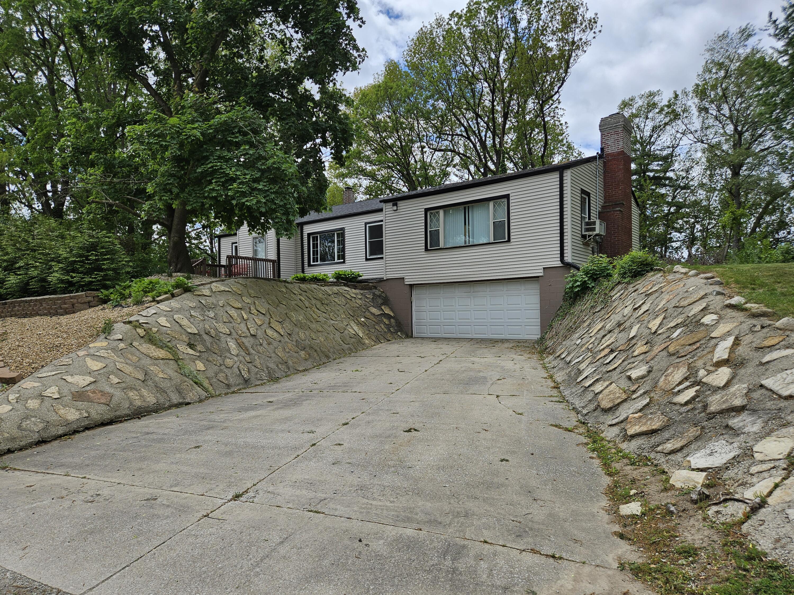 16335 County Line Road Hebron, IN 46341 - Photo 4 of 29 a front view of a house with a yard and trees