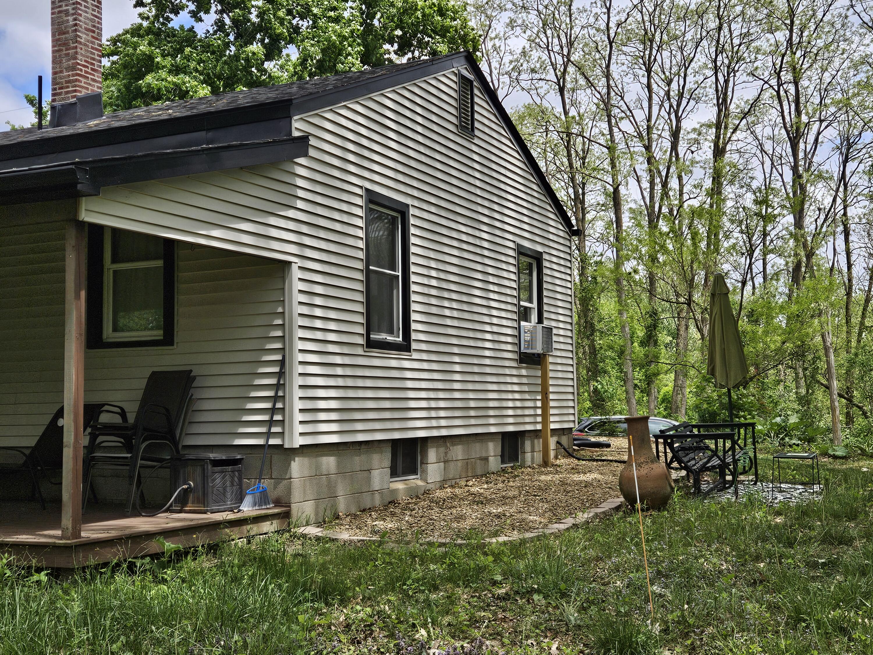 16335 County Line Road Hebron, IN 46341 - Photo 7 of 29 a backyard of a house with seating space