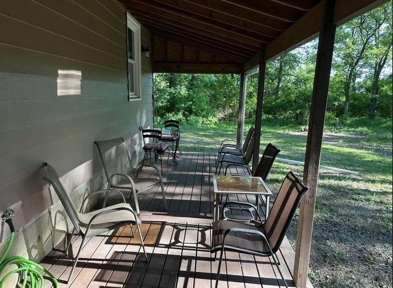 16335 County Line Road Hebron, IN 46341 - Photo 9 of 29 a view of a chairs and table in patio