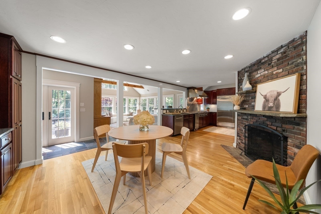 49 Walpole Street Dover, MA 02030 - Photo 6 of 40 a living room with fireplace furniture and a flat screen tv