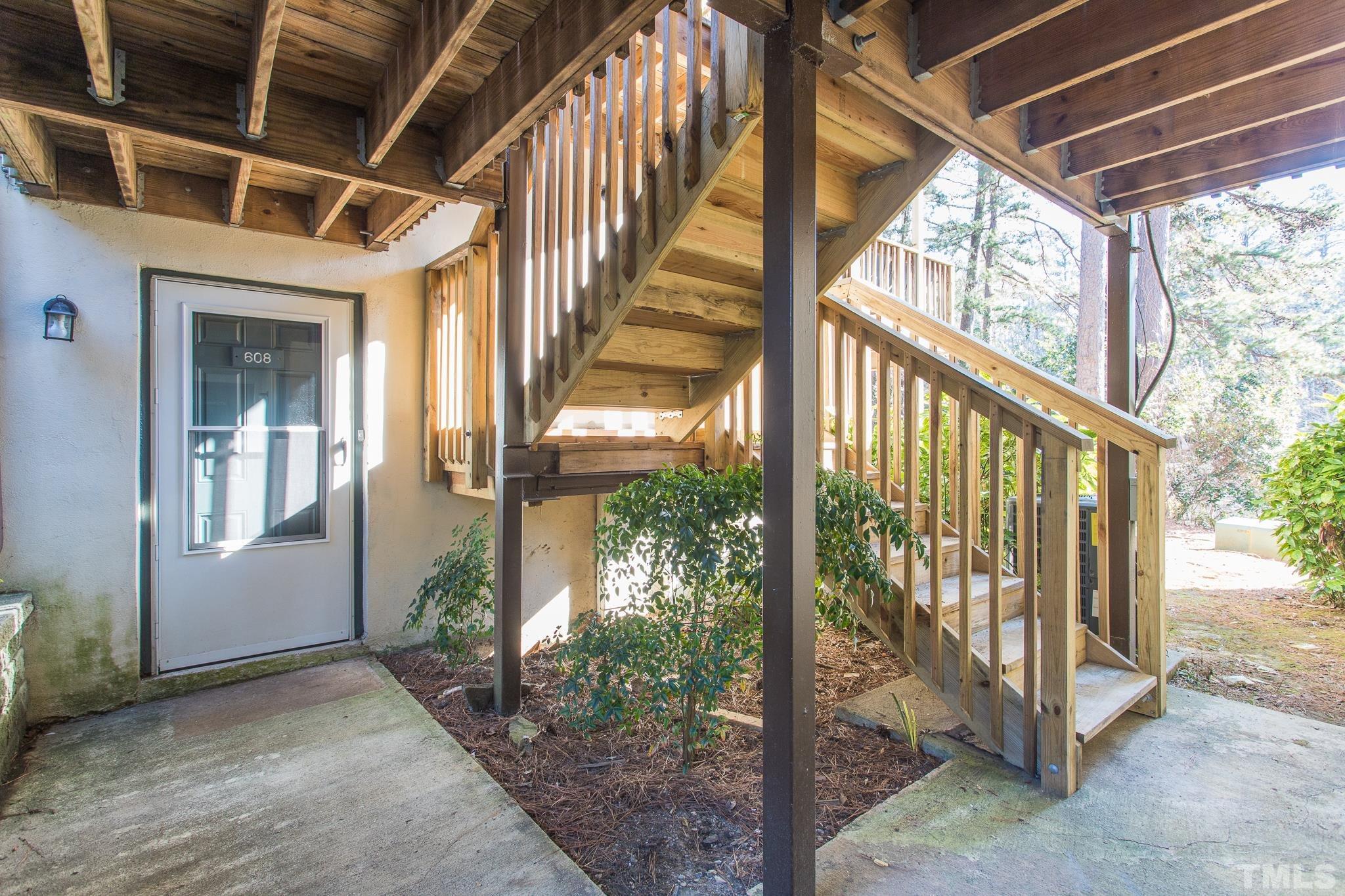 608 Pine Ridge Place, Unit NONE Raleigh, NC 27609 - Photo 3 of 16 a view of an entryway with garden