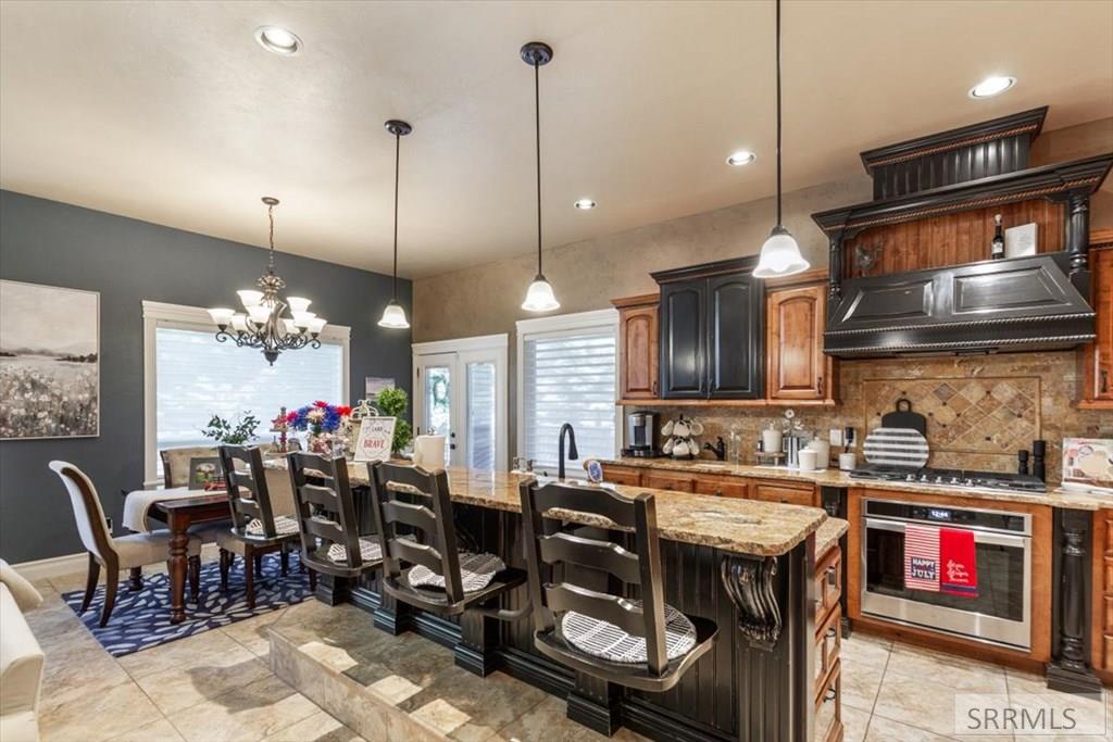 327 Talon Drive Rexburg, ID 83440 - Photo 11 of 45 Raised Breakfast Bar with Attached Seating for 4