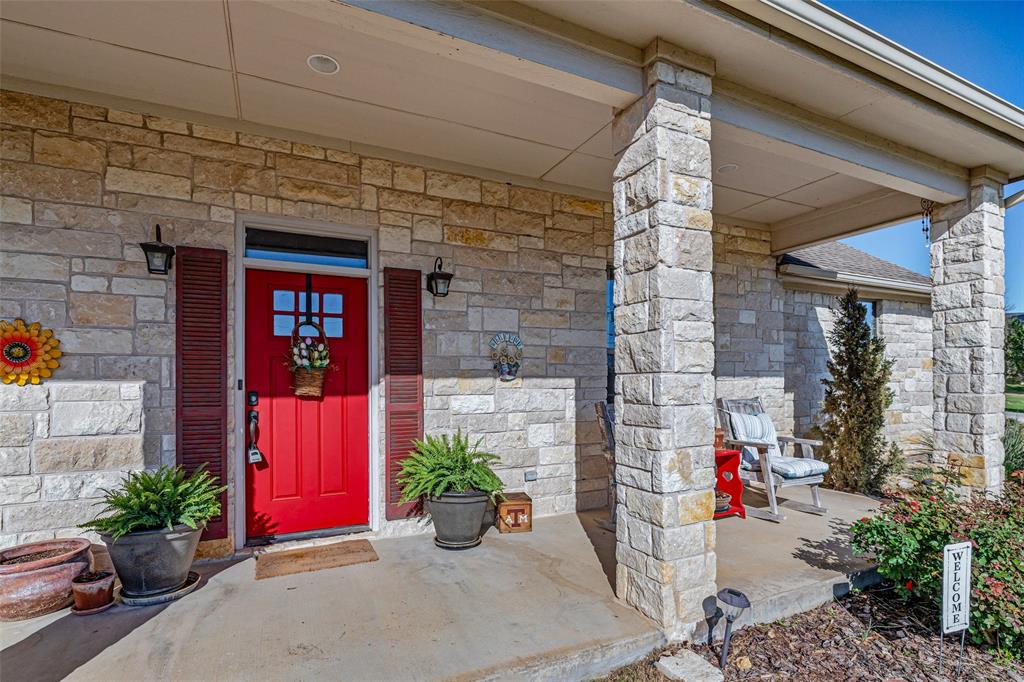 1177 Ronald Road Glen Rose, TX 76043 - Photo 2 of 30 a view of a brick house with potted plants