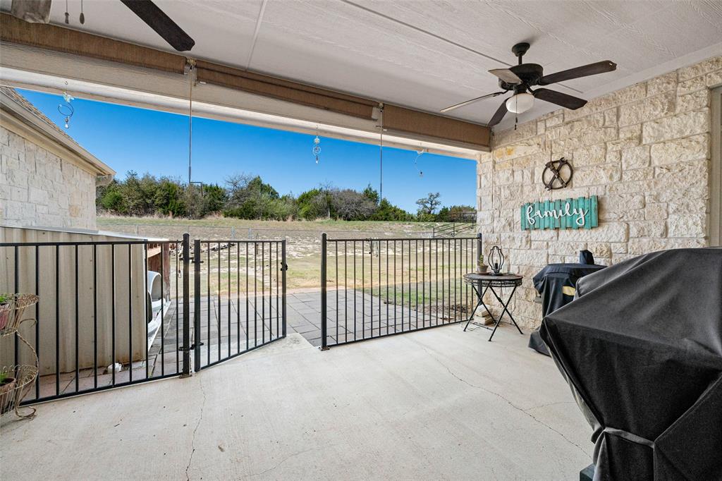 1177 Ronald Road Glen Rose, TX 76043 - Photo 27 of 30 a view of a chairs and table in the patio