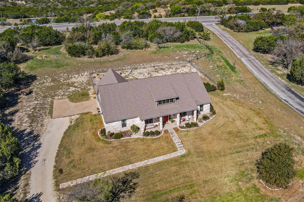 1177 Ronald Road Glen Rose, TX 76043 - Photo 28 of 30 an aerial view of residential houses with outdoor space
