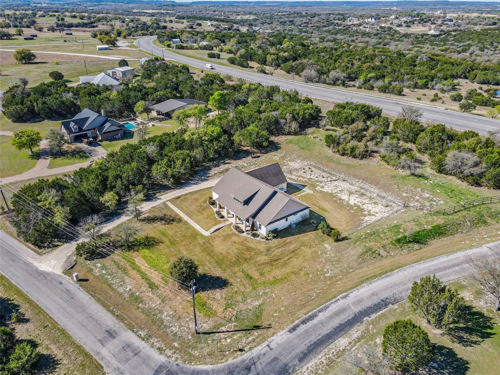 1177 Ronald Road Glen Rose, TX 76043 - Photo 29 of 30 an aerial view of residential houses with outdoor space