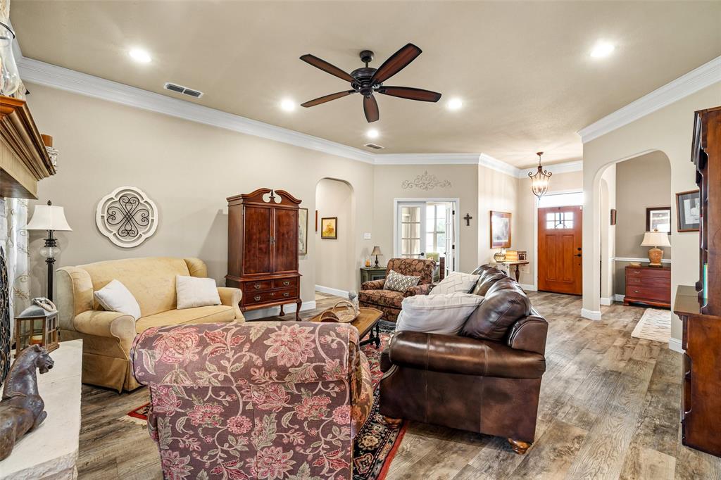 1177 Ronald Road Glen Rose, TX 76043 - Photo 7 of 30 a living room with furniture and a ceiling fan