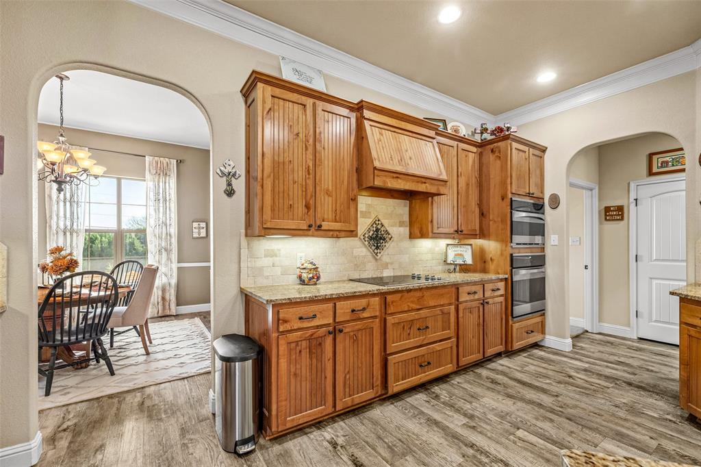 1177 Ronald Road Glen Rose, TX 76043 - Photo 10 of 30 a spacious bathroom with a granite countertop sink a mirror and a shower