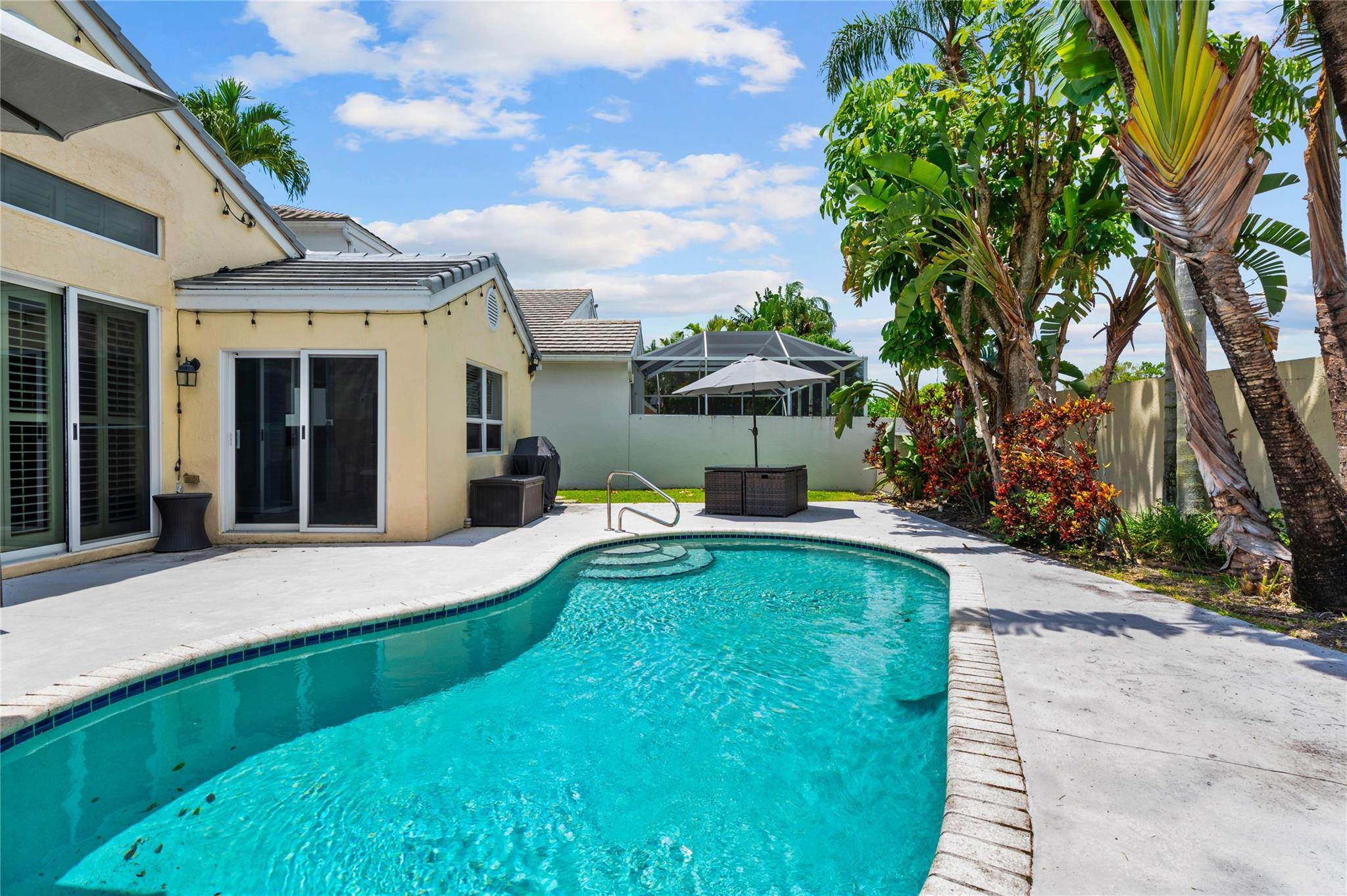 7904 Travelers Tree Drive Boca Raton, FL 33433 - Photo 13 of 35 a view of a house with pool and sitting area