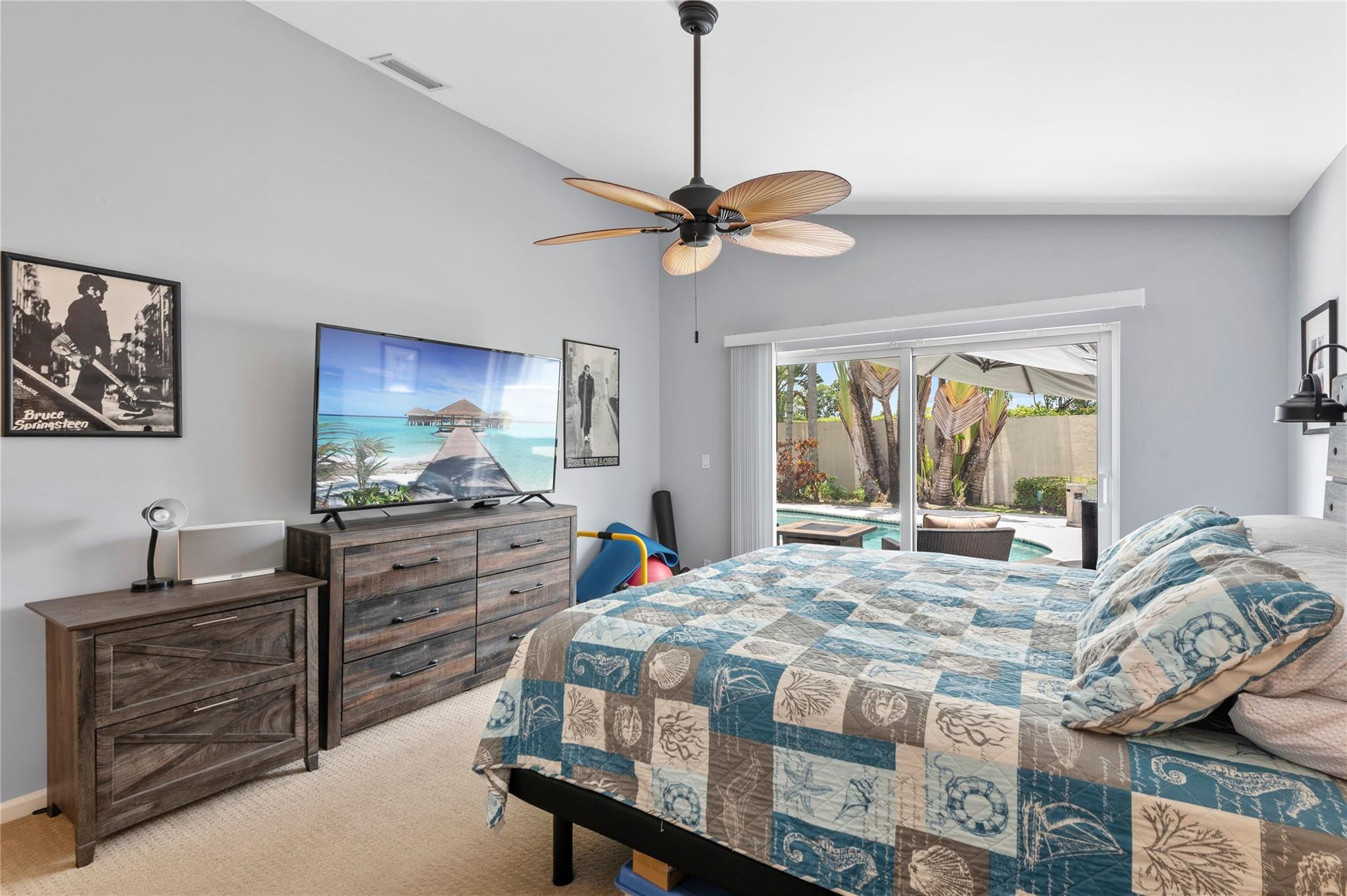 7904 Travelers Tree Drive Boca Raton, FL 33433 - Photo 20 of 35 a bedroom with a bed dresser and a window