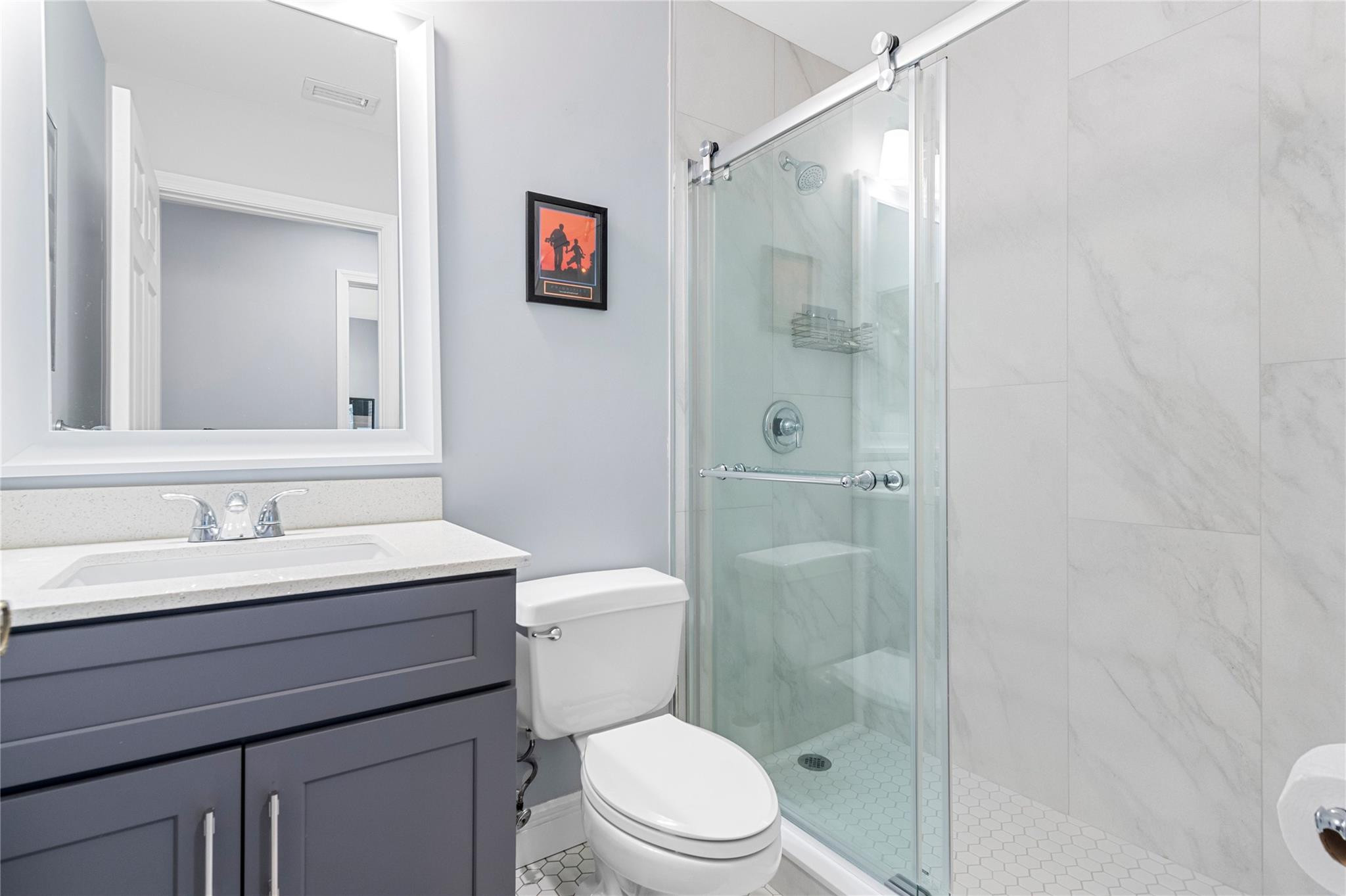 7904 Travelers Tree Drive Boca Raton, FL 33433 - Photo 26 of 35 a bathroom with a sink a toilet and shower