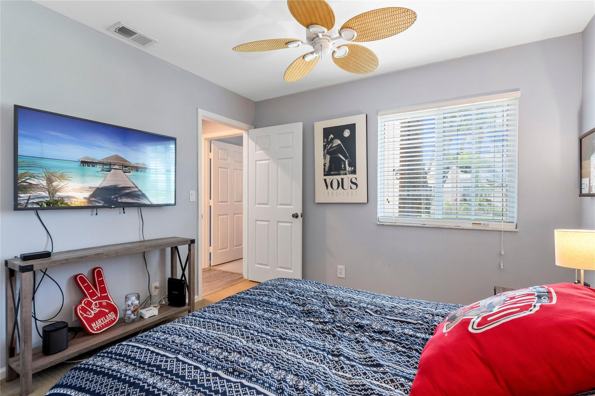 7904 Travelers Tree Drive Boca Raton, FL 33433 - Photo 28 of 35 a bedroom with a bed and a chandelier