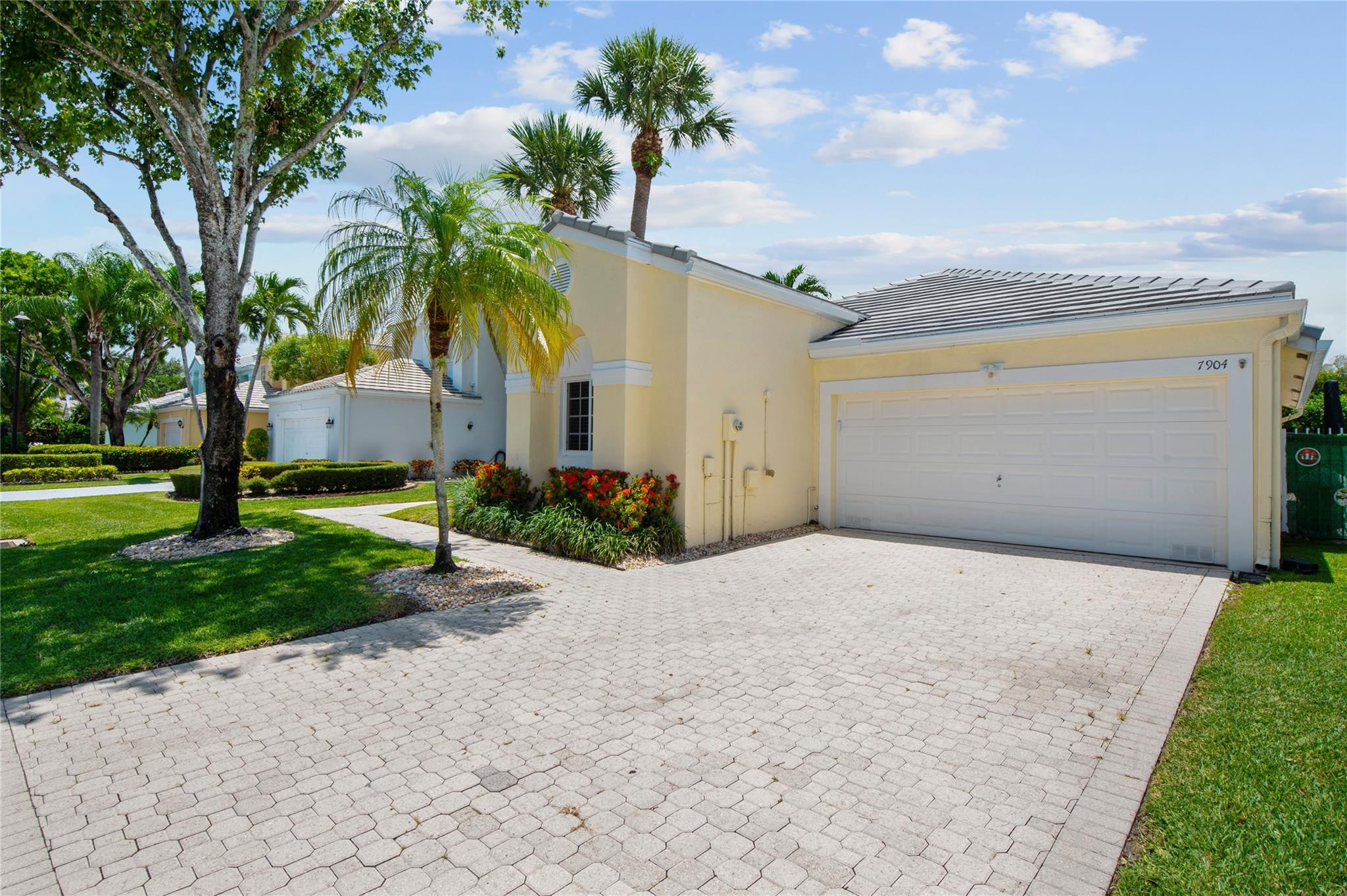 7904 Travelers Tree Drive Boca Raton, FL 33433 - Photo 4 of 35 a front view of house with yard and green space