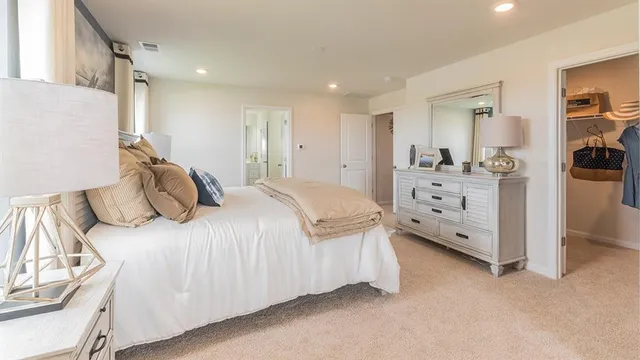 a bedroom with a bed and a cabinets