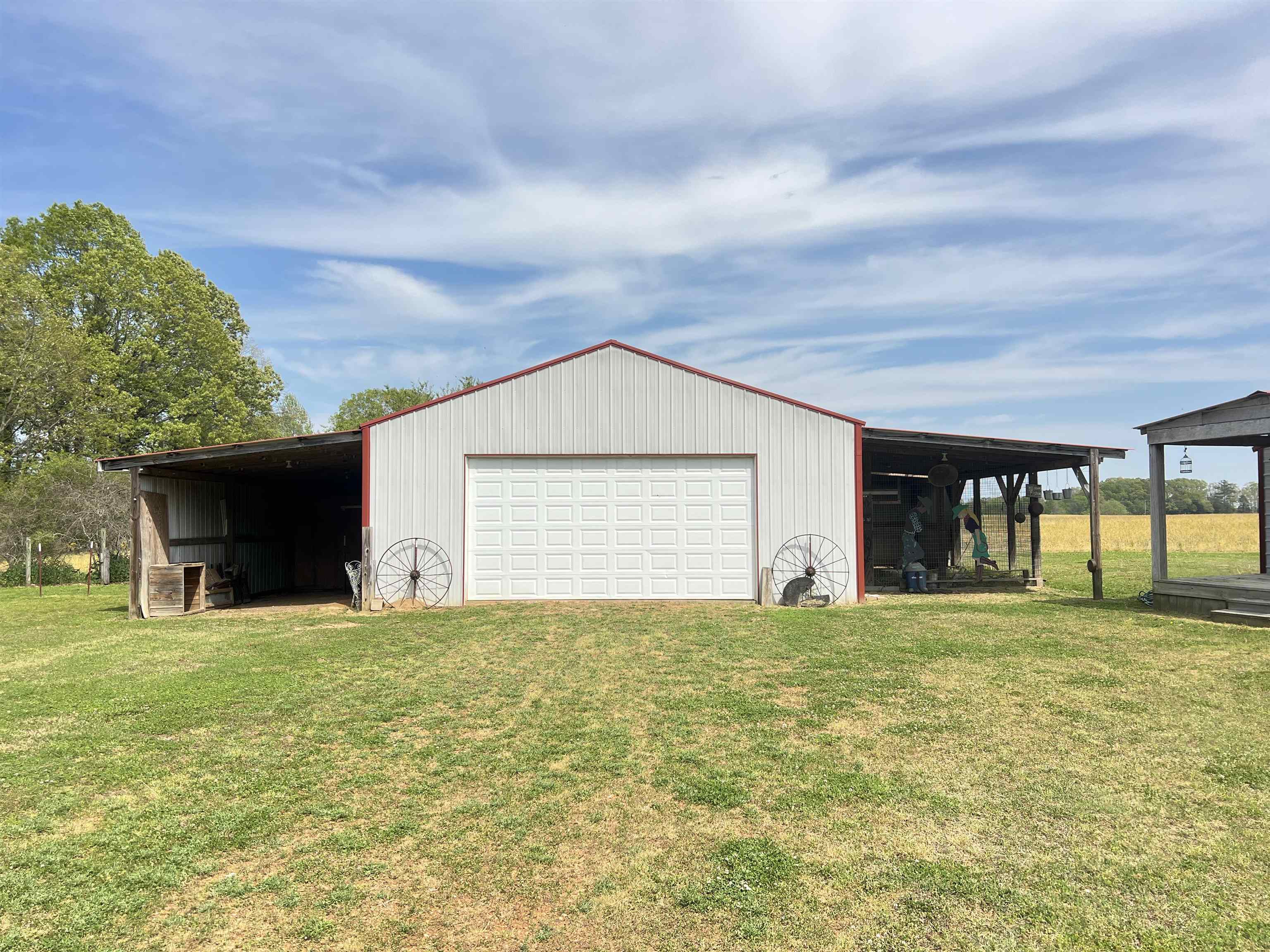 860 Plainview Road Henderson, TN 38340 - Photo 30 of 40 a view of a house with a yard and garage