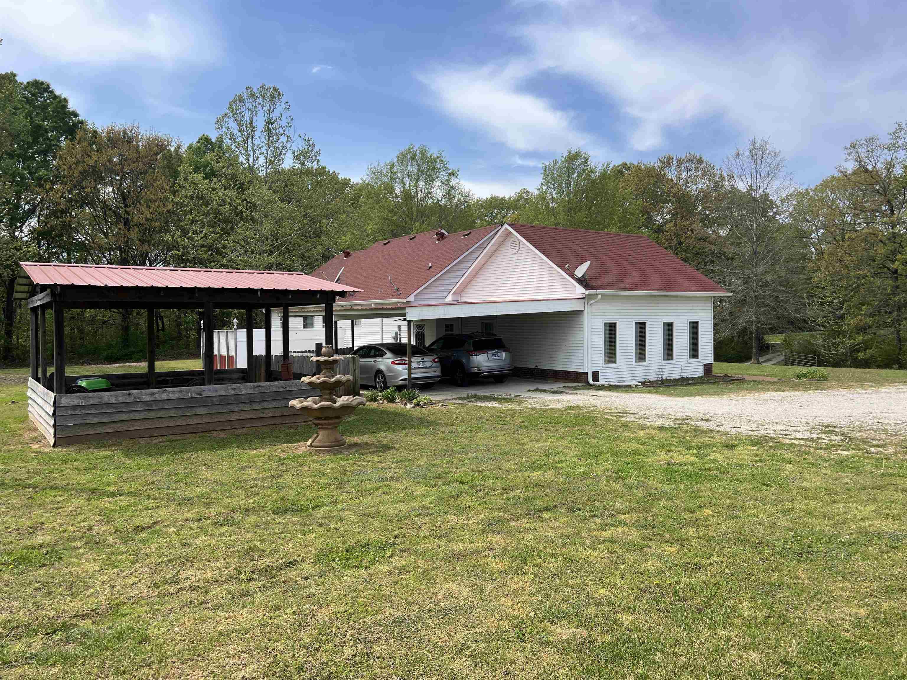 860 Plainview Road Henderson, TN 38340 - Photo 3 of 40 a front view of a house with swimming pool having outdoor seating