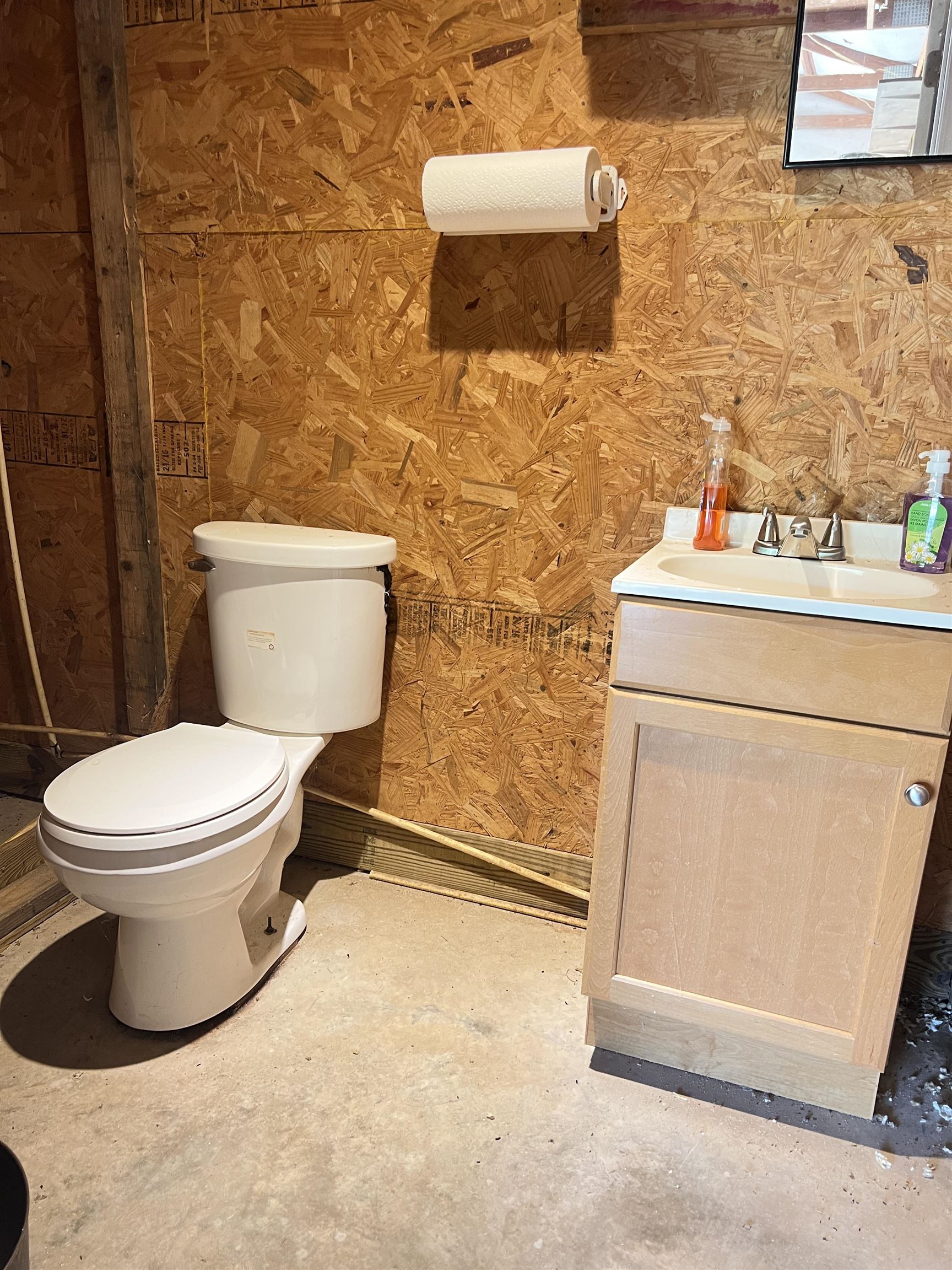 860 Plainview Road Henderson, TN 38340 - Photo 35 of 40 a white toilet sitting next to a bathroom sink