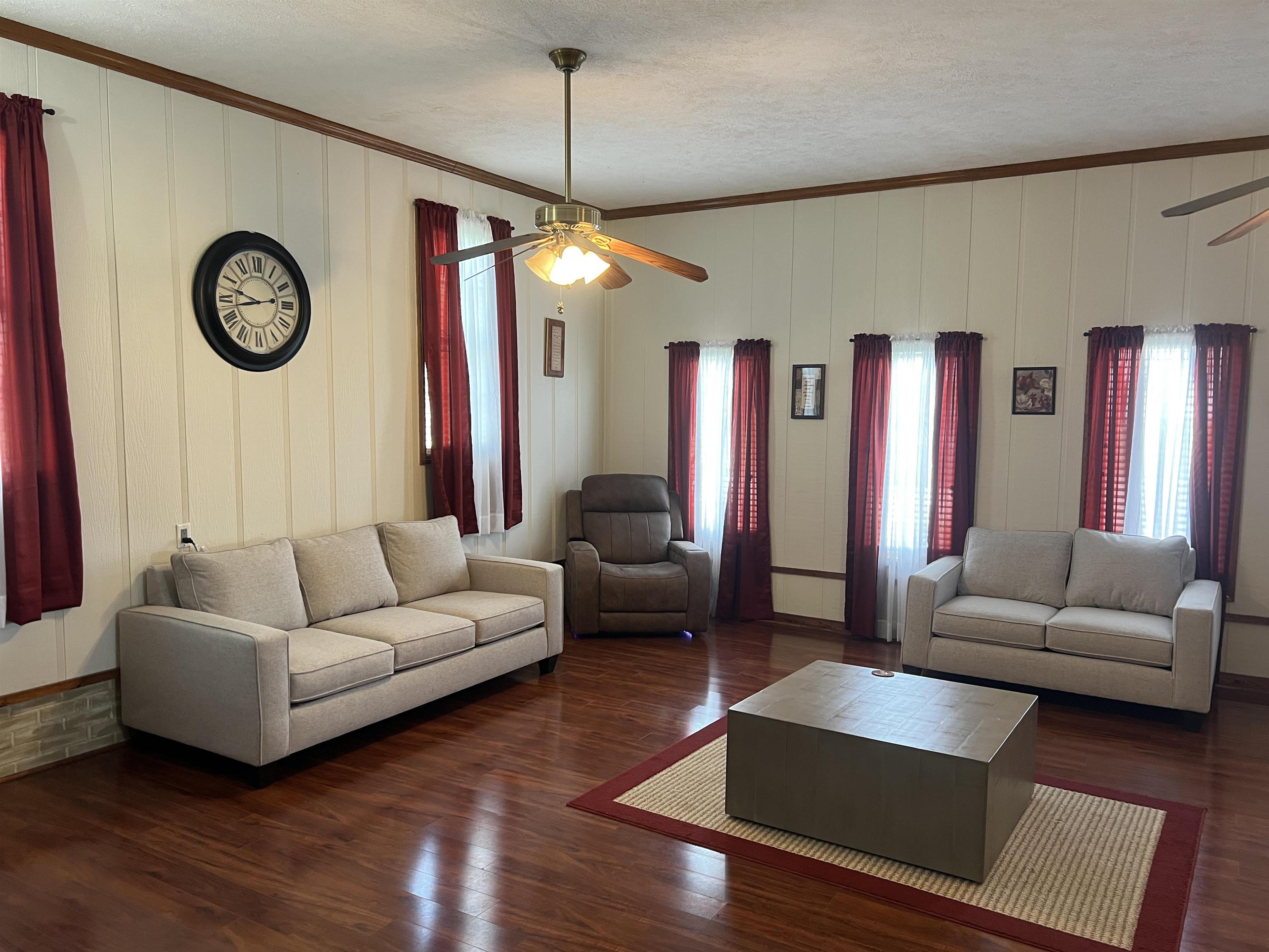 860 Plainview Road Henderson, TN 38340 - Photo 5 of 40 a living room with furniture and a large window
