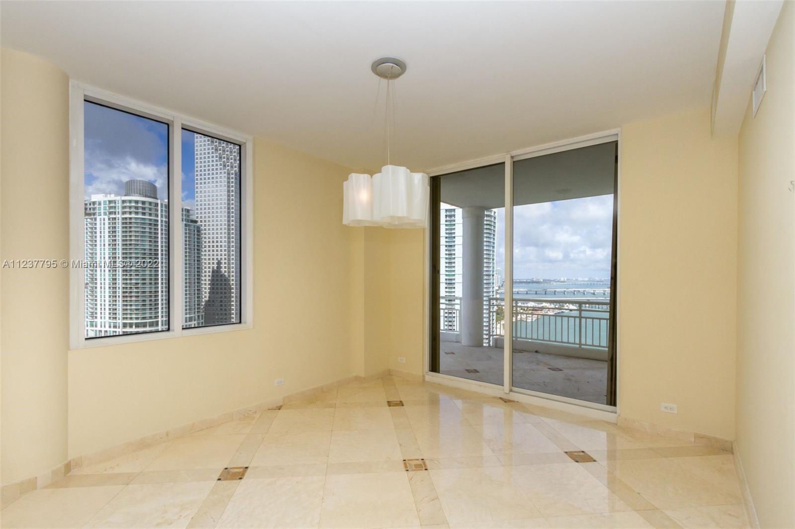 888 Brickell Key Drive, Unit PH2802 Miami, FL 33131 - Photo 11 of 47 a view of an empty room with glass door