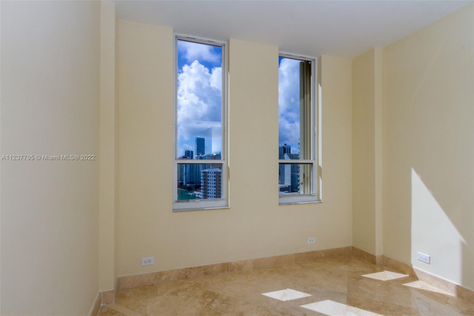 888 Brickell Key Drive, Unit PH2802 Miami, FL 33131 - Photo 12 of 47 an empty room with windows