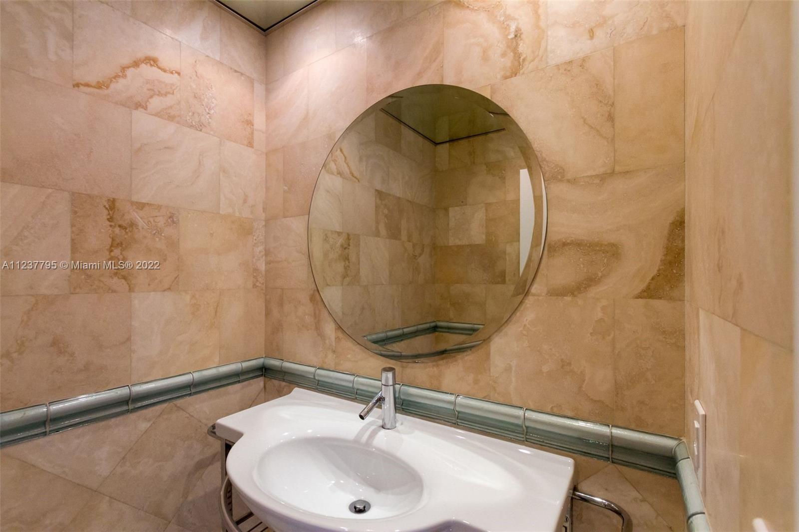 888 Brickell Key Drive, Unit PH2802 Miami, FL 33131 - Photo 18 of 47 a bathroom with a sink and a mirror