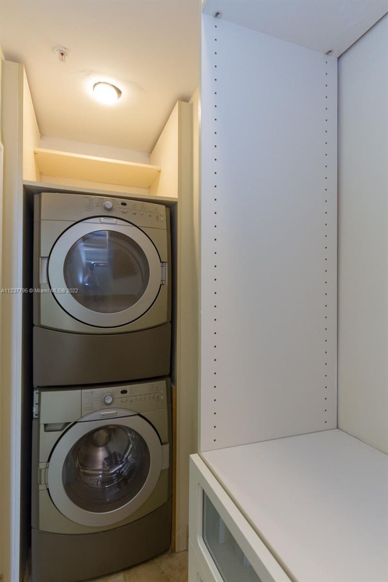 888 Brickell Key Drive, Unit PH2802 Miami, FL 33131 - Photo 21 of 47 a utility room with dryer and washer
