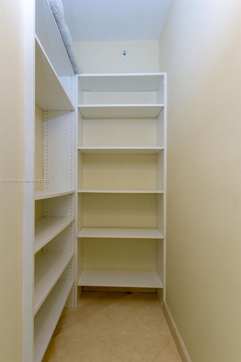 888 Brickell Key Drive, Unit PH2802 Miami, FL 33131 - Photo 27 of 47 a storage room with wooden floor
